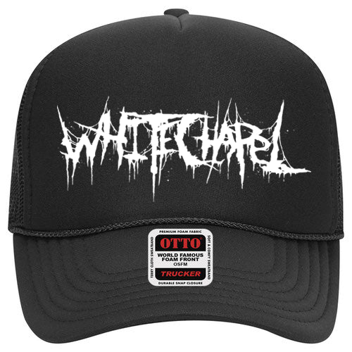 A black snapback trucker hat by Whitechapel featuring a white, jagged Whitechapel logo on the foam front and an OTTO brand sticker on the brim. Available now for presale—reserve yours before shipping starts!.