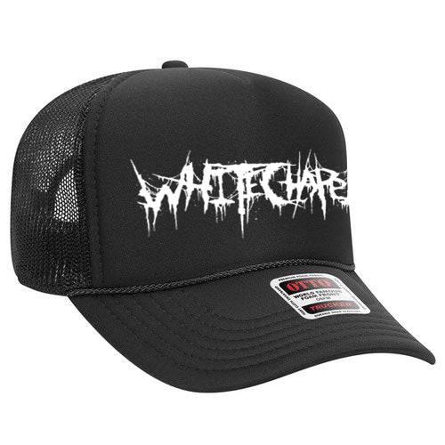 Whitechapel black OTTO Trucker hat with mesh back and a white, jagged Whitechapel logo on the front. Presale item—shipping soon. Bill features OTTO and Trucker Snapback sticker.