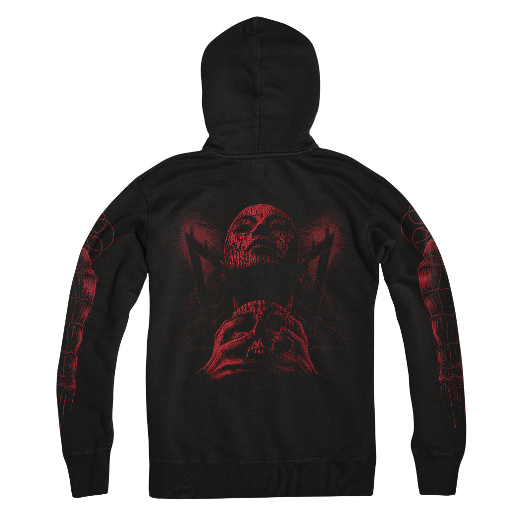  Image of the back of a black hoodie against a white background. There is a red graphic of a person's face with their eyes closed, head up. They have blood on them and are clutching a skull.  The sleeves feature red graphics that are abstract and drip blood.