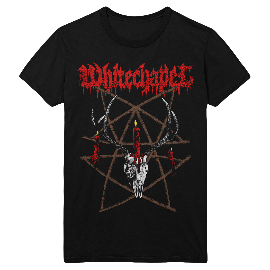  image of a black tee shirt on a white background. front of tee has full body print. at the top in red says whitechapel. below is a deer skull with a burning candle and a pentagram made out of sticks.